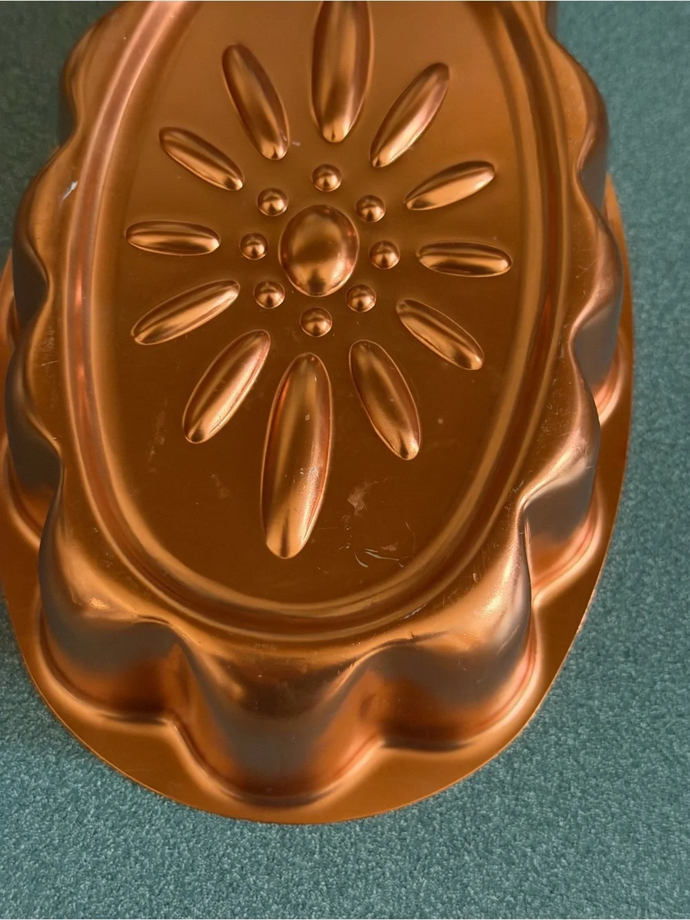 Vintage copper-colored aluminum daisy pattern mold